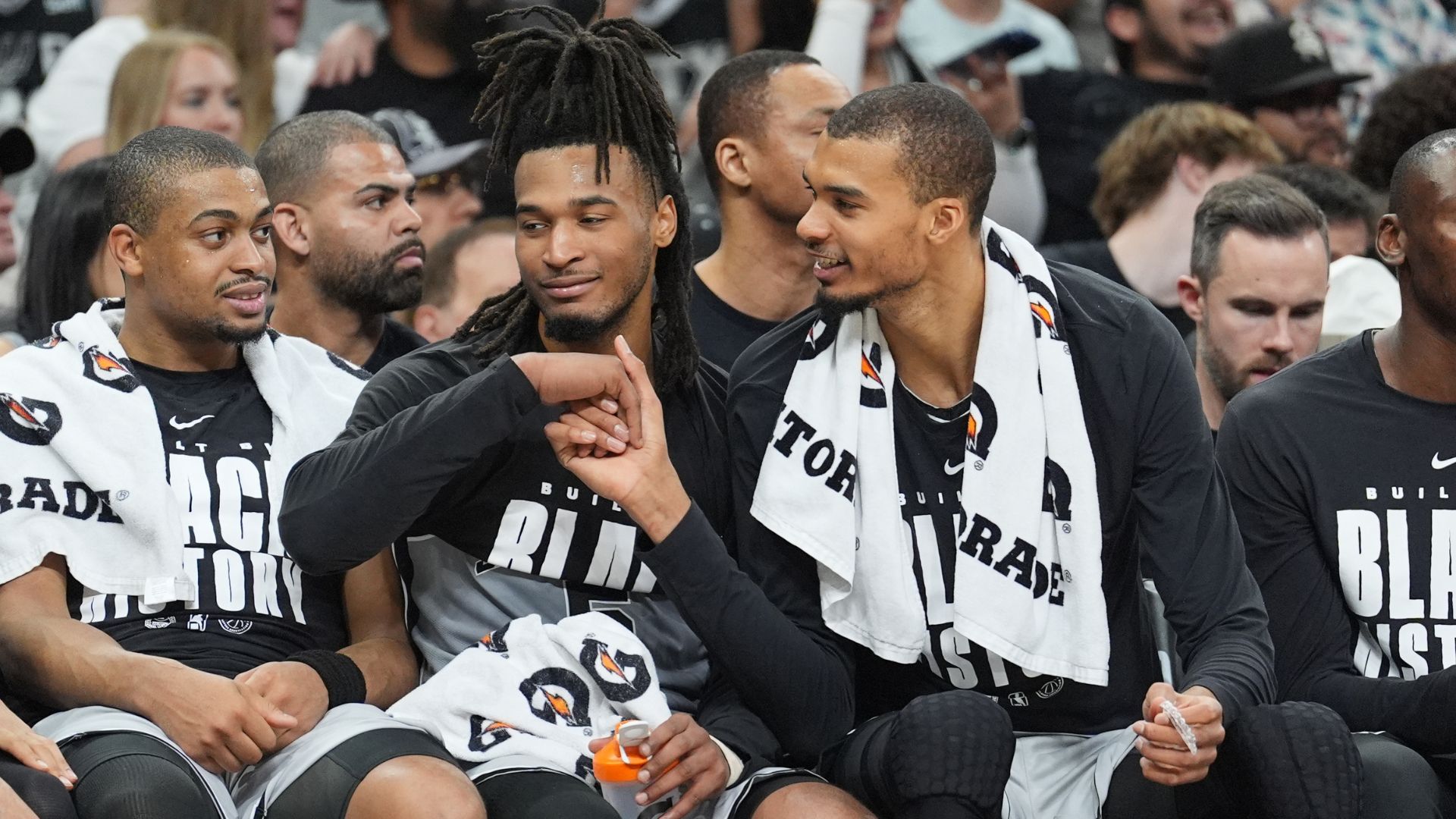 Feb 7, 2026; San Antonio, Texas, USA; San Antonio Spurs forward Victor Wembanyama (1) shakes the hand of guard Stephon Castle (5) during the second half against Dallas Mavericks at Frost Bank Center.