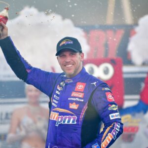 Oct 12, 2025; Las Vegas, Nevada, USA; NASCAR Cup Series driver Denny Hamlin (11) celebrates his victory following the South Point 400 at Las Vegas Motor Speedway