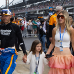 May 26, 2024; Indianapolis, Indiana, USA; Indycar Series driver Kyle Larson holds son Cooper Larson as he walks with daughter Audrey Larson, wife Katelyn Larson and son Owen Larson prior to the 108th running of the Indianapolis 500 at Indianapolis Motor Speedway. Mandatory Credit: Mark J. Rebilas-Imagn Images