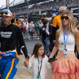 May 26, 2024; Indianapolis, Indiana, USA; Indycar Series driver Kyle Larson holds son Cooper Larson as he walks with daughter Audrey Larson, wife Katelyn Larson and son Owen Larson prior to the 108th running of the Indianapolis 500 at Indianapolis Motor Speedway. Mandatory Credit: Mark J. Rebilas-Imagn Images