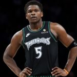 Feb 22, 2026; Minneapolis, Minnesota, USA; Minnesota Timberwolves guard Anthony Edwards (5) looks on during the first half against the Philadelphia 76ers at Target Center.