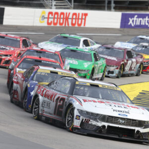 Oct 26, 2025; Martinsville, Virginia, USA; NASCAR Cup Series driver Ryan Blaney (12) leads during stage three of the Xfinity 500 at Martinsville Speedway. Mandatory Credit: Greg Atkins-Imagn Images