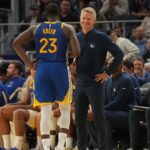 Oct 27, 2025; San Francisco, California, USA; Golden State Warriors head coach Steve Kerr meets with forward Draymond Green (23) after Green fouled out against the Memphis Grizzlies in the fourth quarter at the Chase Center