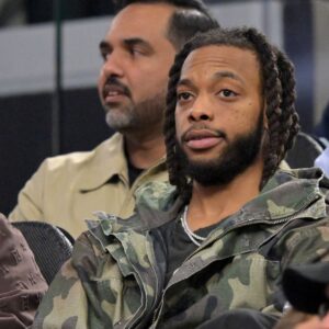 Feb 4, 2026; Inglewood, California, USA; Los Angeles Clippers Darius Garland sits in the stands as he watches the game against the Cleveland Cavaliers in the first half at Intuit Dome
