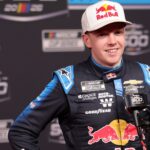 Feb 11, 2026; Daytona Beach, Florida, USA; NASCAR Cup Series driver Connor Zilisch (88) speaks to the media during the Daytona 500 Media Day at Daytona International Speedway