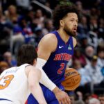 Jan 5, 2026; Detroit, Michigan, USA; Detroit Pistons guard Cade Cunningham (2) dribbles defended by New York Knicks guard Tyler Kolek (13) in the second half at Little Caesars Arena. Mandatory Credit: Rick Osentoski-Imagn Images