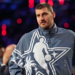 Feb 15, 2026; Inglewood, California, USA; Team World center Nikola Jokic (15) of the Denver Nuggets looks on before game 1 during the 75th NBA All Star Game at Intuit Dome.