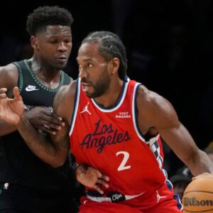 Los Angeles Clippers forward Kawhi Leonard (2) works around Minnesota Timberwolves guard Anthony Edwards (5) in the first quarter at Target Center.