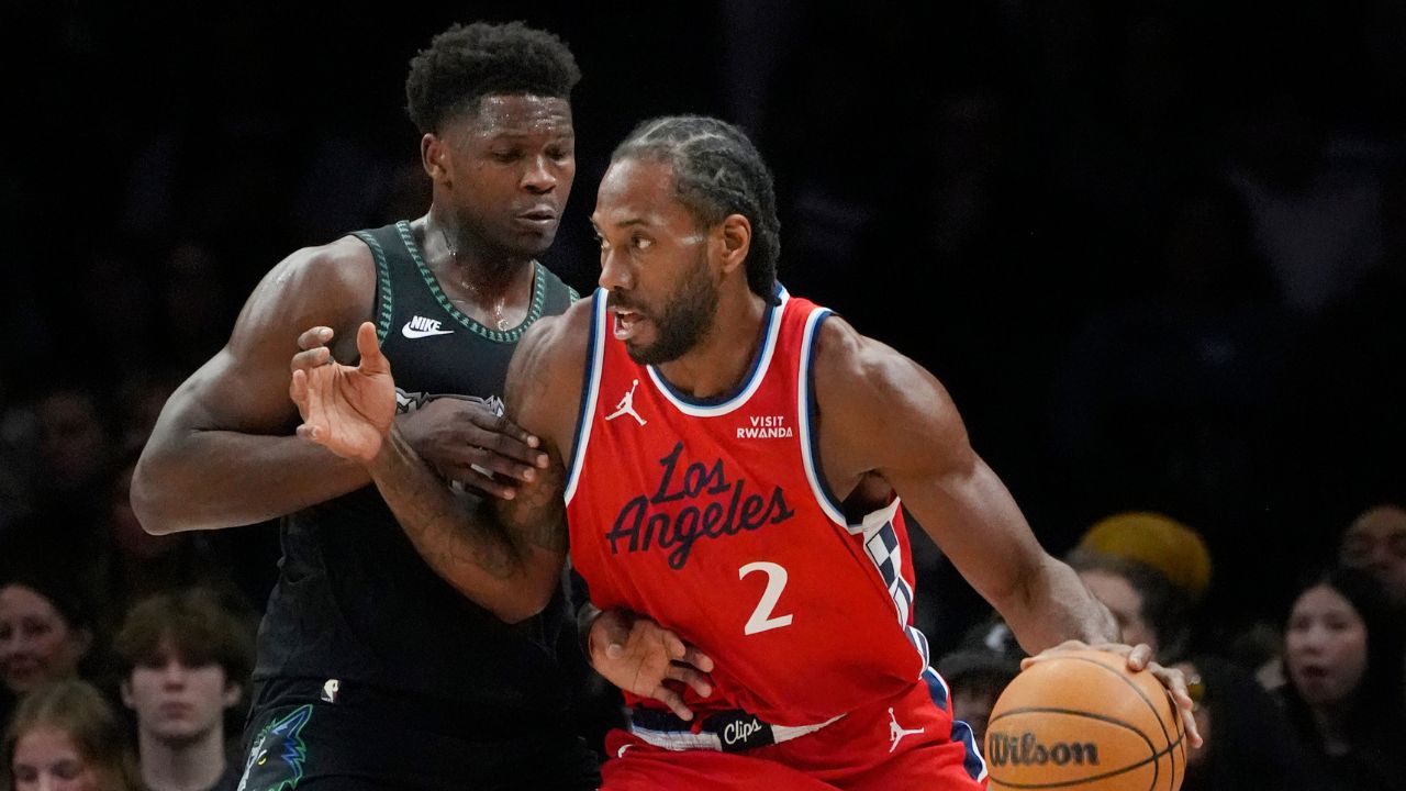 Los Angeles Clippers forward Kawhi Leonard (2) works around Minnesota Timberwolves guard Anthony Edwards (5) in the first quarter at Target Center.