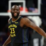 Feb 5, 2026; Phoenix, Arizona, USA; Golden State Warriors forward Draymond Green (23) reacts against the Phoenix Suns in the first half at Mortgage Matchup Center