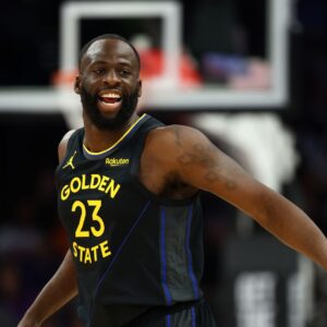 Feb 5, 2026; Phoenix, Arizona, USA; Golden State Warriors forward Draymond Green (23) reacts against the Phoenix Suns in the first half at Mortgage Matchup Center