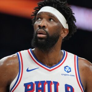 Feb 7, 2026; Phoenix, Arizona, USA; Philadelphia 76ers center Joel Embiid (21) reacts against the Phoenix Suns during the first half of an NBA game at Mortgage Matchup Center