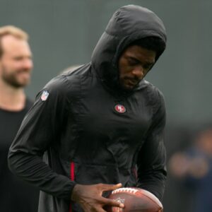 Still recovering from knee surgery, San Francisco 49ers wide receiver Brandon Aiyuk (left) hangs out with teammate George Kittle (85) during the second day of training camp.