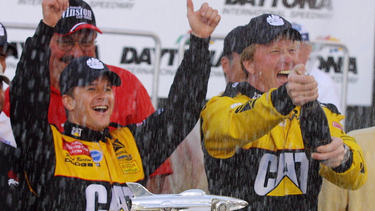 Ward Burton celebrates with his crew chief, Tommy Baldwin in Victory Lane after winning the Daytona 500 at Daytona International Speedway, Sunday, February 17, 2002. Burton won after Sterling Marlin tried to pull a bent piece of sheet metal away from his tire during a red-flag stop in the race. Marlin's gaffe will forever be part of NASCAR's lore, with some saying his illegal attempt to fix his car under the red flag cost him a victory.