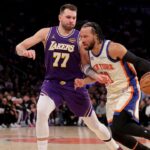 Feb 1, 2026; New York, New York, USA; New York Knicks guard Jalen Brunson (11) drives to the basket against Los Angeles Lakers guard Luka Doncic (77) during the second quarter at Madison Square Garden. Mandatory Credit: Brad Penner-Imagn Images