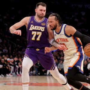 Feb 1, 2026; New York, New York, USA; New York Knicks guard Jalen Brunson (11) drives to the basket against Los Angeles Lakers guard Luka Doncic (77) during the second quarter at Madison Square Garden. Mandatory Credit: Brad Penner-Imagn Images