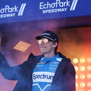 Feb 22, 2026; Hampton, Georgia, USA; NASCAR Cup Series driver Carson Hocevar waves during introductions at EchoPark Speedway.