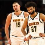 Denver Nuggets guard Jamal Murray (27) and center Nikola Jokic (15) against the Phoenix Suns at the Mortgage Matchup Center