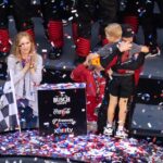 Feb 15, 2026; Daytona Beach, Florida, USA; NASCAR Cup Series driver Tyler Reddick (45) celebrates with son Beau Reddick as wife Alexa DeLeon holds son Rookie Reddick in victory lane after winning the 68th running of the Daytona 500 at Daytona International Speedway.