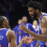 Philadelphia 76ers center Joel Embiid (21) reacts with Philadelphia 76ers guard Tyrese Maxey (L) after a victory against the Sacramento Kings at Xfinity Mobile Arena.
