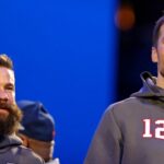 New England Patriots quarterback Tom Brady (12) and wide receiver Julian Edelman (11) during Opening Night for Super Bowl LIII at State Farm Arena.