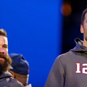 New England Patriots quarterback Tom Brady (12) and wide receiver Julian Edelman (11) during Opening Night for Super Bowl LIII at State Farm Arena.