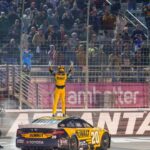 hristopher Bell (20) does his celebratory waves at the crowd after claiming a victory at Atlanta Motor Speedway.