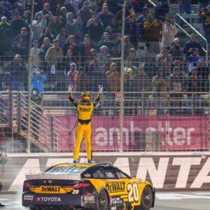 hristopher Bell (20) does his celebratory waves at the crowd after claiming a victory at Atlanta Motor Speedway.