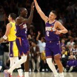 Feb 26, 2026; Phoenix, Arizona, USA; Phoenix Suns guard Grayson Allen (8) celebrates with forward Rasheer Fleming (20) against the Los Angeles Lakers in the second half at Mortgage Matchup Center.
