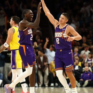 Feb 26, 2026; Phoenix, Arizona, USA; Phoenix Suns guard Grayson Allen (8) celebrates with forward Rasheer Fleming (20) against the Los Angeles Lakers in the second half at Mortgage Matchup Center.
