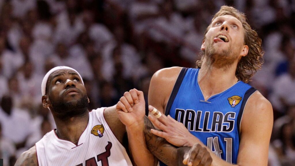 LeBron James, left, and Dirk Nowitzki jockey for position under the basket during Game 6 of the NBA, Basketball Herren, USA Finals between the Miami Heat and the Dallas Mavericks at the AmericanAirlines Arena in Miami on June 12, 2011.