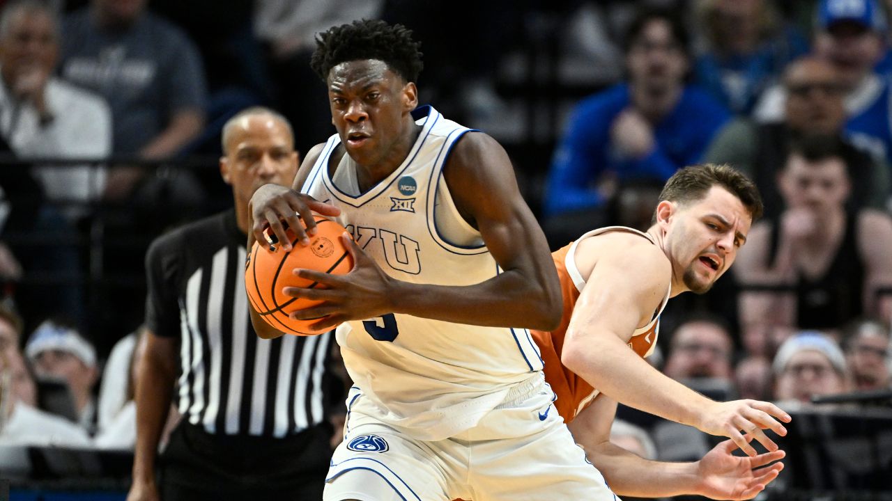 BYU Cougars forward AJ Dybantsa (3) keeps the ball from Texas Longhorns forward Camden Heide (5) in the second half during a first round game of the men's 2026 NCAA Tournament at Moda Center.