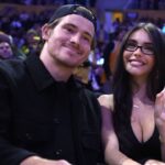 Los Angeles Chargers quarterback Justin Herbert (left) and girlfriend Madison Beer attend the game between the Minnesota Timberwolves and the Los Angeles Lakers at Crypto.com Arena.