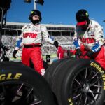 Feb 22, 2026; Hampton, Georgia, USA; Raptor team members work on the tires at EchoPark Speedway.