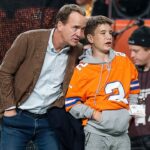 Former Denver Broncos player Peyton Manning with his son Marshall before the game against the Cleveland Browns at Empower Field at Mile High.
