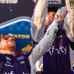 Mar 22, 2026; Darlington, South Carolina, USA; 23XI Racing Tyler Reddick (45) celebrates in Victory Lane after winning at Darlington Raceway.