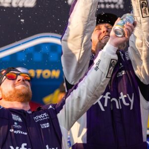 Mar 22, 2026; Darlington, South Carolina, USA; 23XI Racing Tyler Reddick (45) celebrates in Victory Lane after winning at Darlington Raceway.
