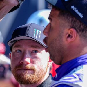 Nov 2, 2024; Martinsville, Virginia, USA; NASCAR Cup Series driver Tyler Reddick (45) listens to teammate Bubba Wallace (23) during cup qualifying at Martinsville Speedway.