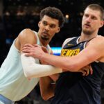 ; San Antonio Spurs center Victor Wembanyama (1) and Denver Nuggets center Nikola Jokic (15) battle for position during an inbound pass in the second half at Frost Bank Center