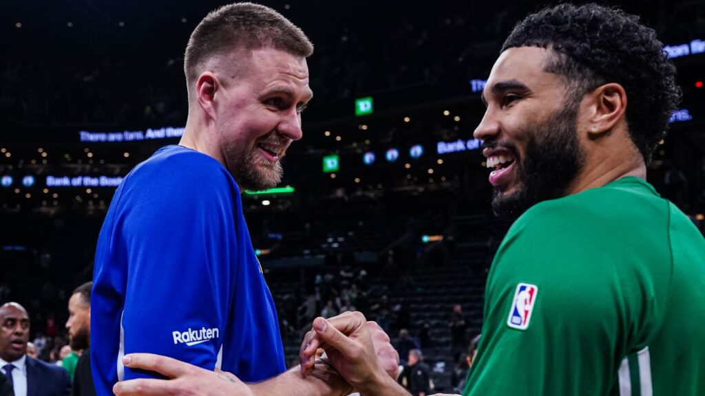 Golden State Warriors center Kristaps Porzingis (7) talks with Boston Celtics forward Jayson Tatum (0) after the game at TD Garden.