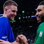 Golden State Warriors center Kristaps Porzingis (7) talks with Boston Celtics forward Jayson Tatum (0) after the game at TD Garden.