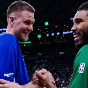 Golden State Warriors center Kristaps Porzingis (7) talks with Boston Celtics forward Jayson Tatum (0) after the game at TD Garden.