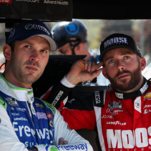 Aug 19, 2023; Watkins Glen, New York, USA; NASCAR Cup Series driver Daniel Suarez (left) and driver Ross Chastain (right) look on during practice and qualifying for the Go Bowling at The Glen at Watkins Glen International. Mandatory Credit: Matthew O'Haren-Imagn Images