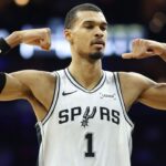 San Antonio Spurs forward Victor Wembanyama (1) reacts after his team scores against the Philadelphia 76ers during the second quarter at Xfinity Mobile Arena