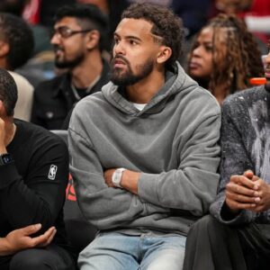 Washington Wizards guard Trae Young (3) watches from the bench during the game against the Atlanta Hawks during the second half at State Farm Arena