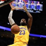 Los Angeles Lakers forward LeBron James (23) dunks against the Miami Heat during the first half at Kaseya Center.