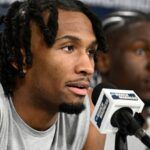 Mar 19, 2026; San Diego, CA, USA; Kansas Jayhawks guard Darryn Peterson (22) speaks at a news conference ahead of the first round of the men's 2026 NCAA Tournament at Viejas Arena.