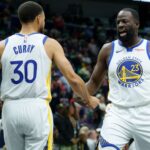 Nov 16, 2025; New Orleans, Louisiana, USA; Golden State Warriors forward Draymond Green (23) celebrates with guard Stephen Curry (30) during the first half against the New Orleans Pelicans at Smoothie King Center
