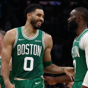 Boston Celtics forward Jayson Tatum (0) has a laugh with guard Jaylen Brown (7) during the second half against the Dallas Mavericks at TD Garden.