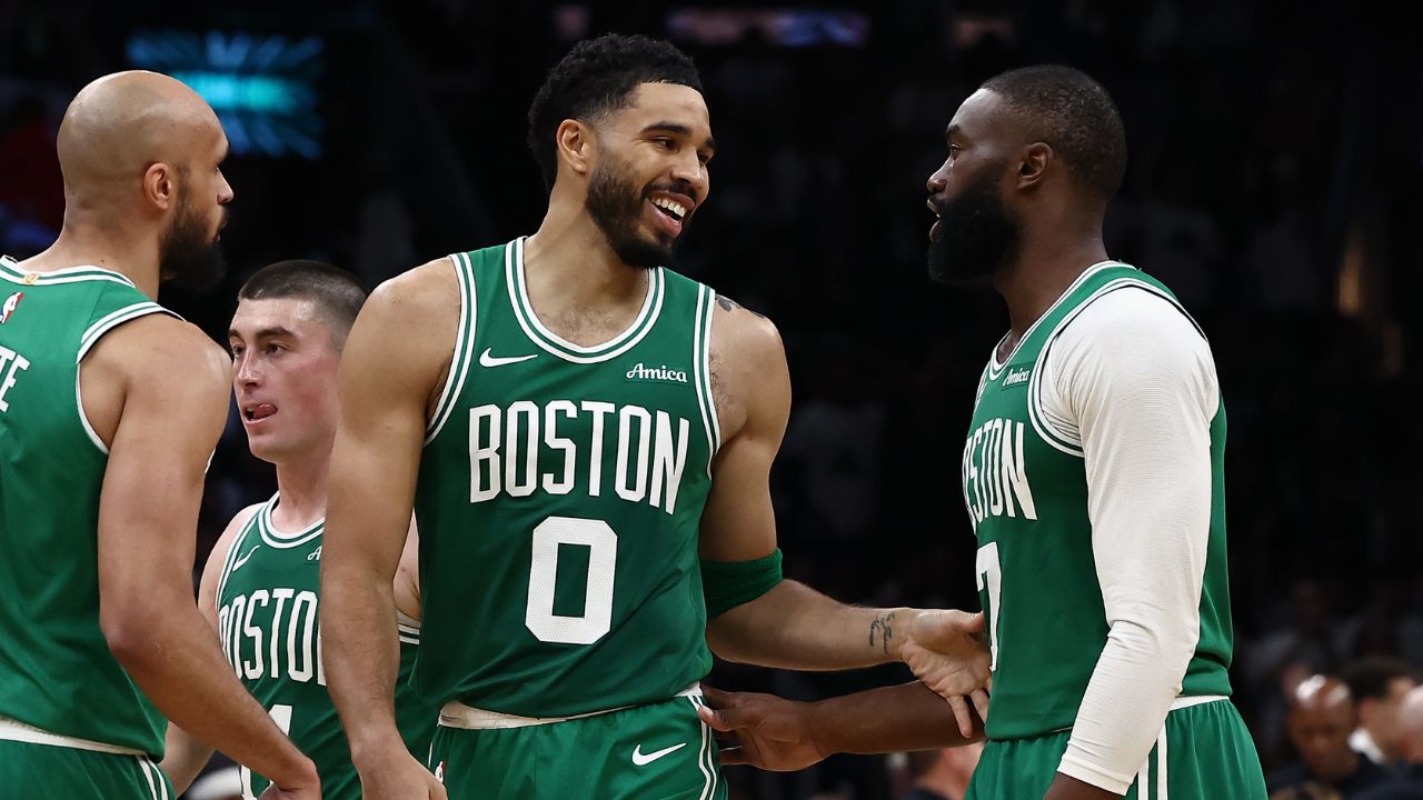 Boston Celtics forward Jayson Tatum (0) has a laugh with guard Jaylen Brown (7) during the second half against the Dallas Mavericks at TD Garden.